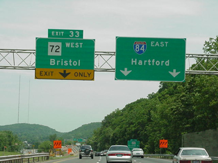 Signs on I-84 east for CT 72 west